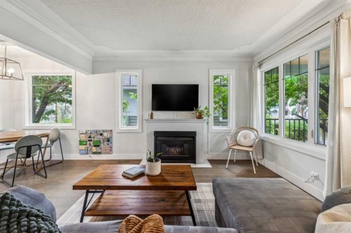 1644 16 Street Se, Calgary, AB - Indoor Photo Showing Living Room With Fireplace