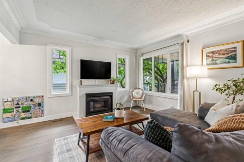 1644 16 Street Se, Calgary, AB - Indoor Photo Showing Living Room With Fireplace
