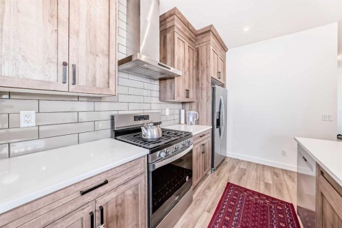 330 Ambleton Drive Nw, Calgary, AB - Indoor Photo Showing Kitchen With Upgraded Kitchen