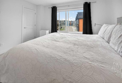 606-550 Seton Circle Se, Calgary, AB - Indoor Photo Showing Bedroom