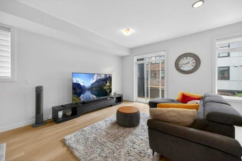 606-550 Seton Circle Se, Calgary, AB - Indoor Photo Showing Living Room