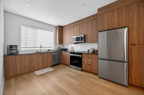 606-550 Seton Circle Se, Calgary, AB - Indoor Photo Showing Kitchen With Double Sink
