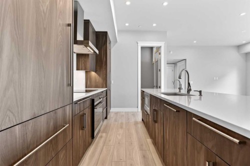 302-275 Lebel Crescent Nw, Calgary, AB - Indoor Photo Showing Kitchen With Upgraded Kitchen