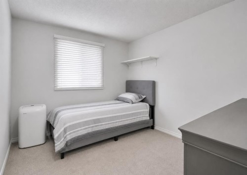 896 Rundlecairn Way Ne, Calgary, AB - Indoor Photo Showing Bedroom