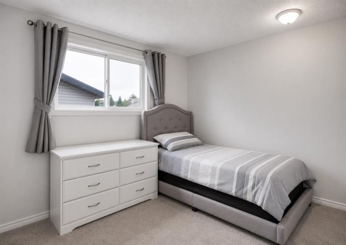 896 Rundlecairn Way Ne, Calgary, AB - Indoor Photo Showing Bedroom