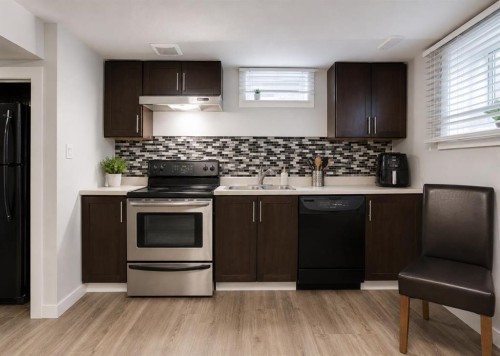 896 Rundlecairn Way Ne, Calgary, AB - Indoor Photo Showing Kitchen With Double Sink With Upgraded Kitchen