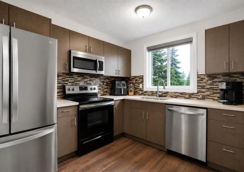 896 Rundlecairn Way Ne, Calgary, AB - Indoor Photo Showing Kitchen With Double Sink