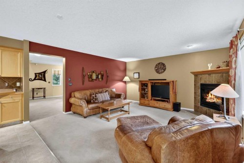 14 Evergreen Common Sw, Calgary, AB - Indoor Photo Showing Living Room With Fireplace