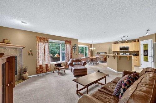 14 Evergreen Common Sw, Calgary, AB - Indoor Photo Showing Living Room With Fireplace