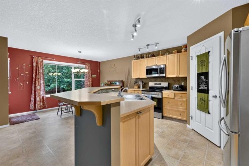 14 Evergreen Common Sw, Calgary, AB - Indoor Photo Showing Kitchen With Double Sink