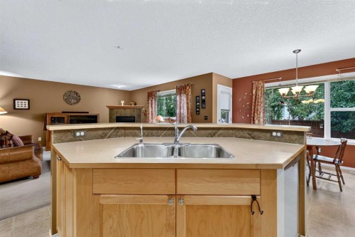 14 Evergreen Common Sw, Calgary, AB - Indoor Photo Showing Kitchen With Double Sink