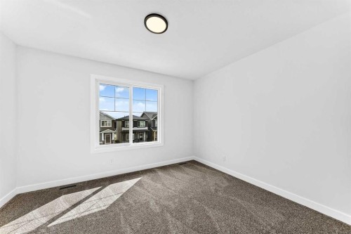 583 Buffaloberry Manor Se, Calgary, AB - Indoor Photo Showing Other Room