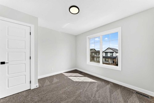 583 Buffaloberry Manor Se, Calgary, AB - Indoor Photo Showing Other Room