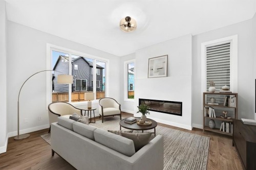 583 Buffaloberry Manor Se, Calgary, AB - Indoor Photo Showing Living Room With Fireplace
