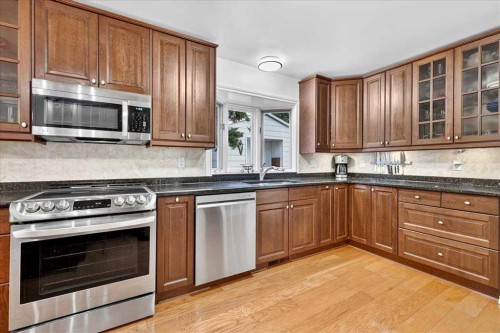 1707 107 Avenue Sw, Calgary, AB - Indoor Photo Showing Kitchen With Stainless Steel Kitchen