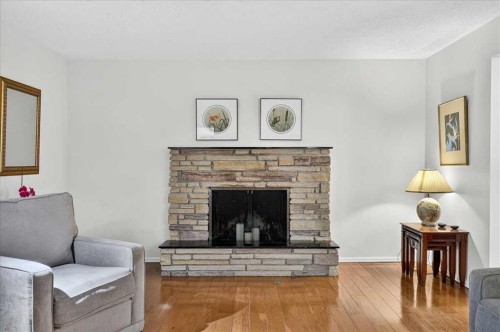 1707 107 Avenue Sw, Calgary, AB - Indoor Photo Showing Living Room With Fireplace
