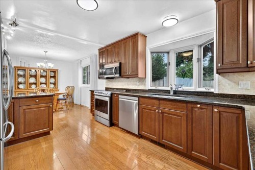 1707 107 Avenue Sw, Calgary, AB - Indoor Photo Showing Kitchen With Stainless Steel Kitchen