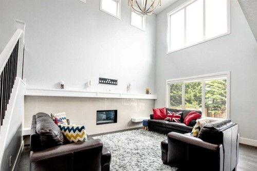 40 Westmore Place Sw, Calgary, AB - Indoor Photo Showing Other Room With Fireplace