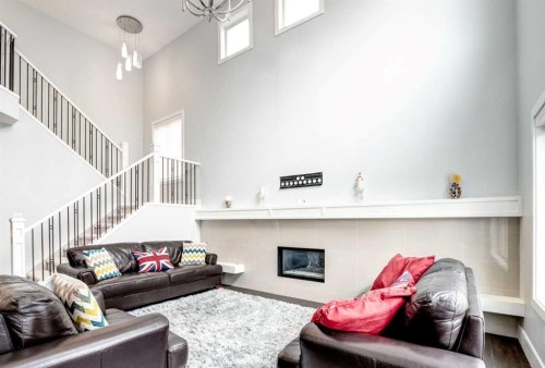 40 Westmore Place Sw, Calgary, AB - Indoor With Fireplace