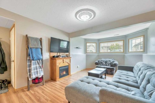 1907 Strathcona Terrace, Strathmore, AB - Indoor Photo Showing Living Room With Fireplace