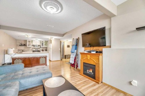 1907 Strathcona Terrace, Strathmore, AB - Indoor Photo Showing Living Room With Fireplace