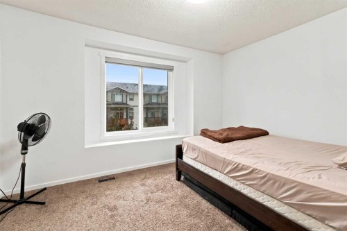 98 Panatella Hill Nw, Calgary, AB - Indoor Photo Showing Bedroom