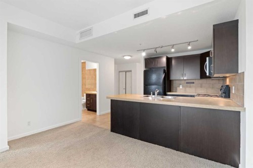 309-1410 1 Street Se, Calgary, AB - Indoor Photo Showing Kitchen