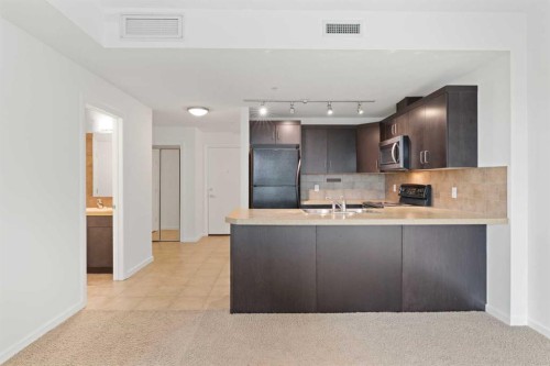 309-1410 1 Street Se, Calgary, AB - Indoor Photo Showing Kitchen