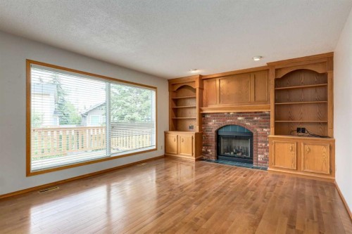 183 Edgevalley Circle Nw, Calgary, AB - Indoor Photo Showing Living Room With Fireplace