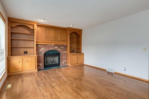 183 Edgevalley Circle Nw, Calgary, AB - Indoor Photo Showing Living Room With Fireplace