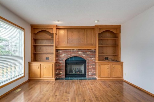 183 Edgevalley Circle Nw, Calgary, AB - Indoor Photo Showing Living Room With Fireplace