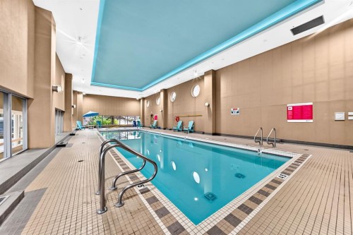1405-99 Spruce Place Sw, Calgary, AB - Indoor Photo Showing Other Room With In Ground Pool