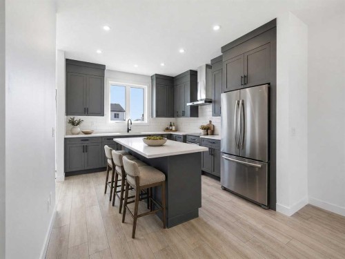 217 Bridgeport Gate, Chestermere, AB - Indoor Photo Showing Kitchen With Upgraded Kitchen