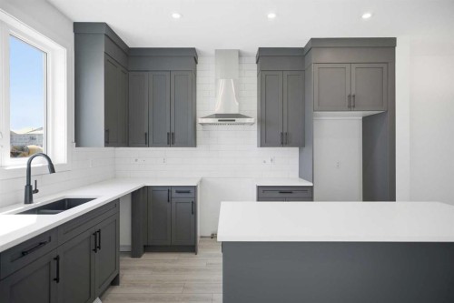 217 Bridgeport Gate, Chestermere, AB - Indoor Photo Showing Kitchen With Double Sink