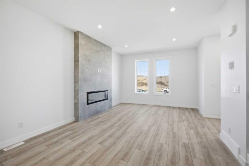 217 Bridgeport Gate, Chestermere, AB - Indoor With Fireplace