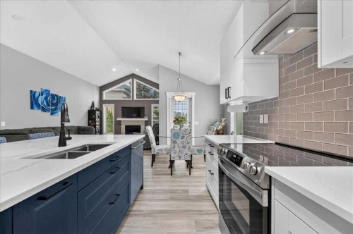212 Cresthaven Place Sw, Calgary, AB - Indoor Photo Showing Kitchen With Double Sink With Upgraded Kitchen