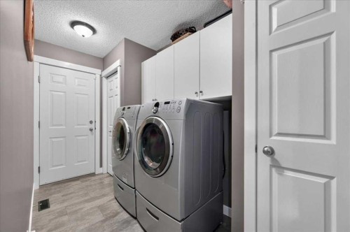212 Cresthaven Place Sw, Calgary, AB - Indoor Photo Showing Laundry Room