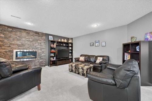 212 Cresthaven Place Sw, Calgary, AB - Indoor Photo Showing Living Room With Fireplace