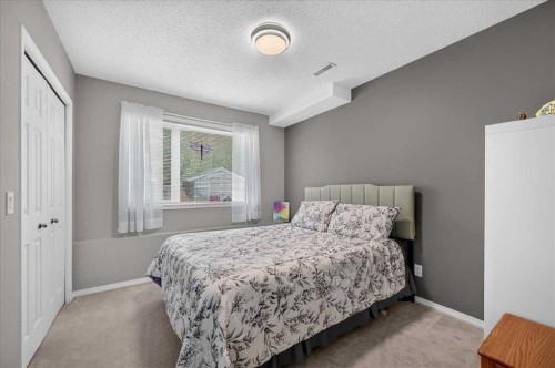 212 Cresthaven Place Sw, Calgary, AB - Indoor Photo Showing Bedroom