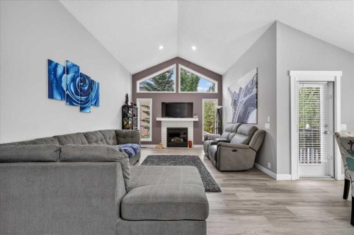 212 Cresthaven Place Sw, Calgary, AB - Indoor Photo Showing Living Room With Fireplace