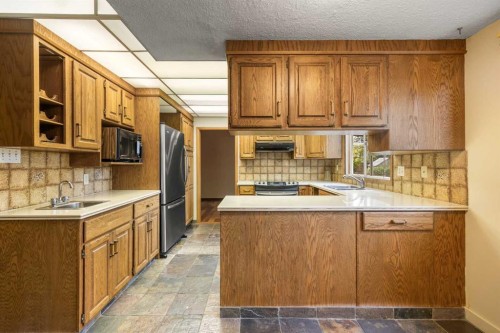4804 Nordegg Crescent Nw, Calgary, AB - Indoor Photo Showing Kitchen With Double Sink