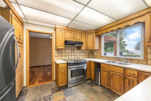 4804 Nordegg Crescent Nw, Calgary, AB - Indoor Photo Showing Kitchen With Double Sink