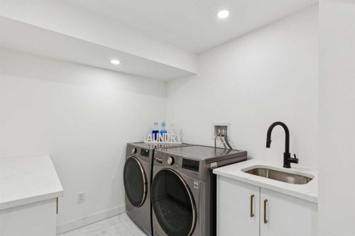 14 Butte Place Nw, Calgary, AB - Indoor Photo Showing Laundry Room