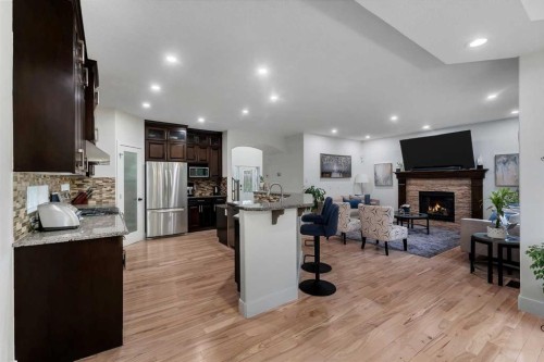 109 Evanscove Heights, Calgary, AB - Indoor Photo Showing Kitchen With Fireplace