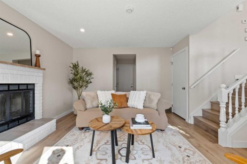 19 Macewan Meadow Crescent Nw, Calgary, AB - Indoor Photo Showing Living Room With Fireplace
