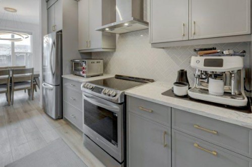 174 Rowley Gate Nw, Calgary, AB - Indoor Photo Showing Kitchen With Stainless Steel Kitchen