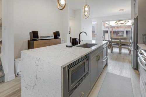 174 Rowley Gate Nw, Calgary, AB - Indoor Photo Showing Kitchen With Upgraded Kitchen
