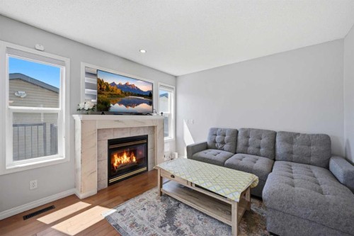 33 Saddlecrest Close Ne, Calgary, AB - Indoor Photo Showing Living Room With Fireplace