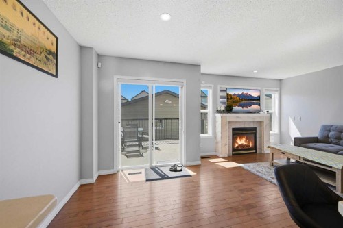 33 Saddlecrest Close Ne, Calgary, AB - Indoor Photo Showing Living Room With Fireplace
