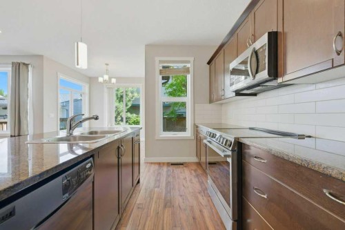 98 Elgin Meadows Circle Se, Calgary, AB - Indoor Photo Showing Kitchen With Double Sink With Upgraded Kitchen